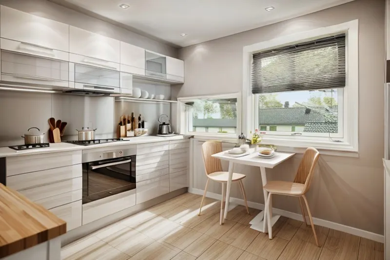 Minimalist version: flat white cabinets, a plain grey splashback, a white table and nothing on the walls