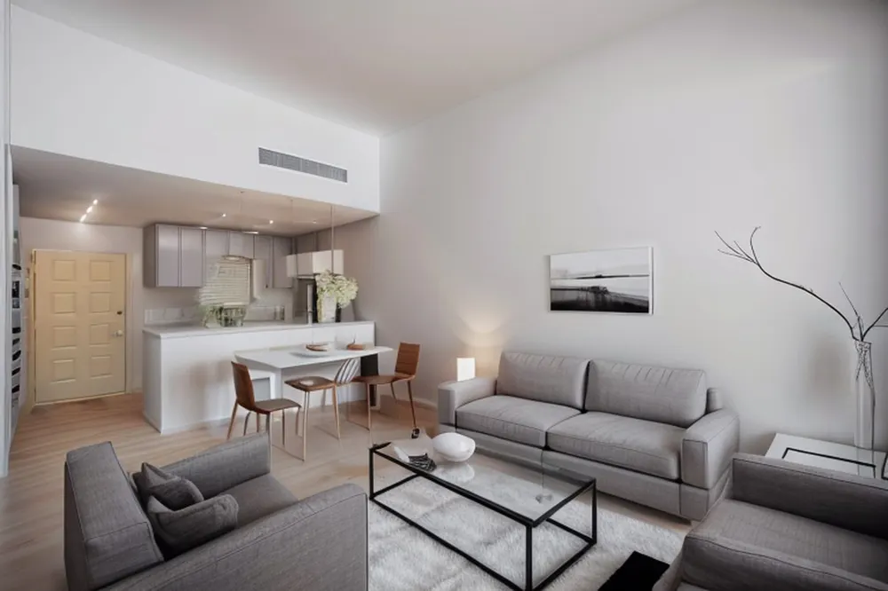 After: the same room in minimalist style with wood dining chairs, a white open kitchen and a pale rug